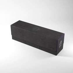 The ACADEMIC 266+ XL - BLACK & PURPLE from GameGenic is a rectangular game box made of leather-like material. It features embossed graphics on the top and side surfaces, highlighted by a purple trim along the edges. This premium deck box is sleek, neatly closed, and designed for storing or carrying collectibles or card game accessories.