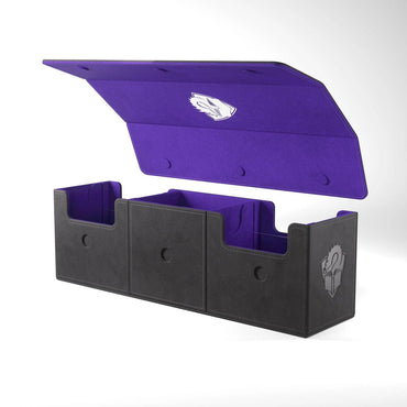 The ACADEMIC 266+ XL - BLACK & PURPLE by GameGenic is displayed with its lid open, revealing a luxurious purple interior contrasted with a sleek black exterior. This multifunctional deck box boasts three compartments, each designed with a curved cutout for effortless access. The lid and sides are adorned with an elegant silver helmet logo, highlighting the vibrant purple within. Ideal for card game accessories.