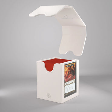 A white, premium SQUIRE PLUS 100+ XL CONVERTIBLE deck box by GameGenic, featuring a textured finish and vibrant red interior, is displayed with its magnetic lid open and hovering above it. Inside the SQUIRE PLUS box, a Magic: The Gathering™ trading card is visible through a transparent window on the front. The card showcases striking artwork in a mix of red and orange hues.
