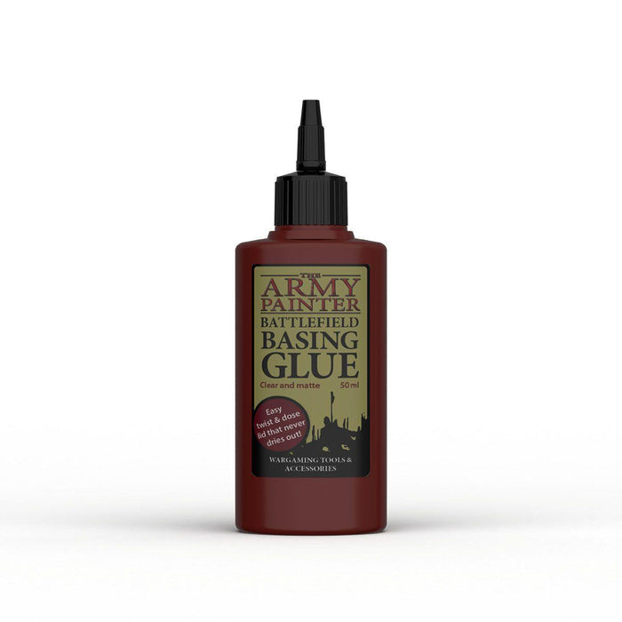 A 50ml bottle of Army Painter Army Paint Basing Glue with a black twist cap. The label features a greenish-gold background that informs it is clear, matte, and non-toxic glue, easy to use, dries fast and doesn't run. Suitable for wargaming, tools, accessories, and gluing polyfoam.