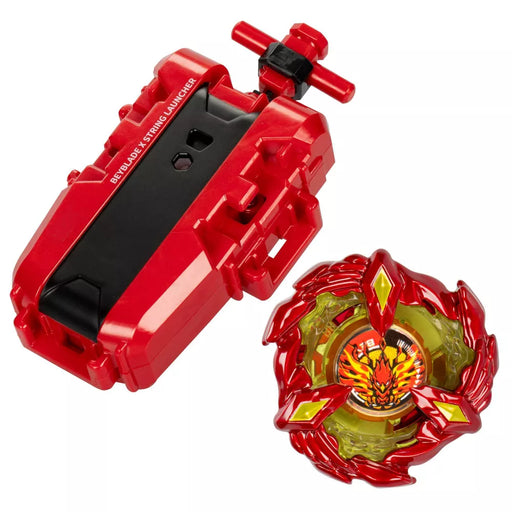 The Beyblade X Soar Phoenix 9-60GF Deluxe String Launcher Set by Hasbro lies before me. The set includes a red and black string launcher equipped with the advanced X-Celerator Gear System for powerful launches, alongside a Beyblade top designed with a striking red and yellow flame-like motif featuring sharp edges and a vibrant green center that creates a dynamic, fiery appearance.