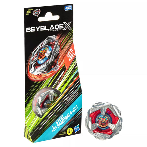 The image shows a Beyblade toy called the "Beyblade Steel Samurai Balance Battle Top" in its packaging and outside of it. The vibrant red and orange packaging features graphics highlighting the X-Celerator Gear System. The silver and red Beyblade, produced by Hasbro, is suitable for ages 8 and up.