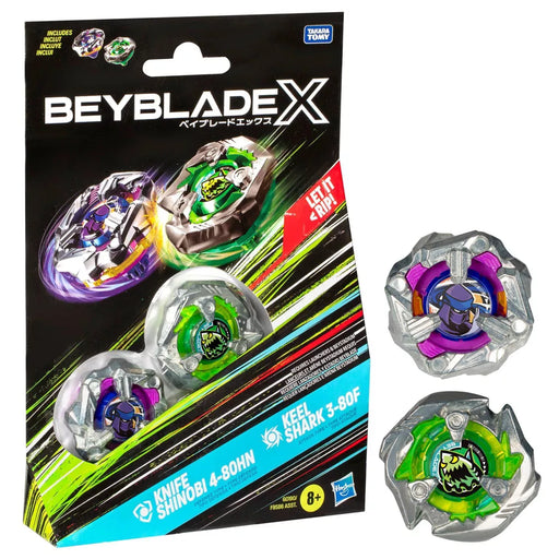 Packaging of Hasbro's Beyblade Knife Shinobi Defense and Keel Shark Attack Battle Tops features two Beyblades: Knife Shinobi 4-80H and Keel Shark 3-80F. The predominantly black package with action graphics showcases both Beyblades, inside and out. Logos and text highlight the X-Celerator Gear System and note the toy is for ages 8 and up.