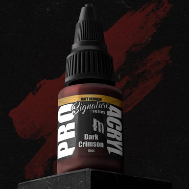 The Monument Hobbies Matt Cexwish Dark Crimson Pro Acryl is spotlighted on a dark background with red brush strokes. It features an innovative no-clog cap, premium high-density pigment, and a sleek black cap with bold white and gold labeling.