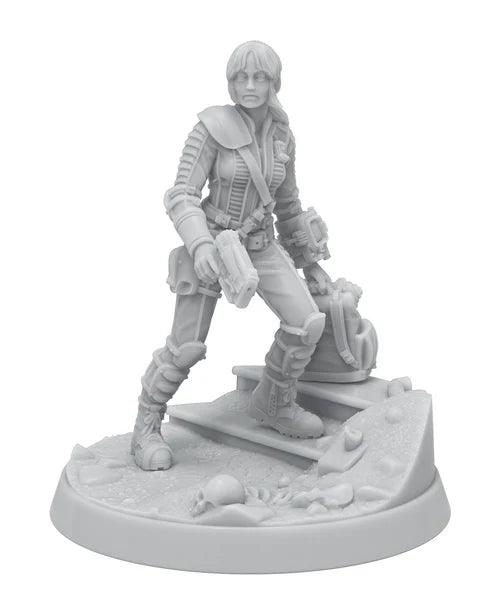 A highly detailed, unpainted miniature figure of a warrior standing on a textured round base, holding two pistols. The character is dressed in futuristic armor with a holster on the hip and a shoulder pad. Part of the Modiphius Fallout: Miniatures - Hollywood Heroes (Amazon TV Show Tie-In) set, the scene includes a small staircase and scattered debris, including a skull at the base.