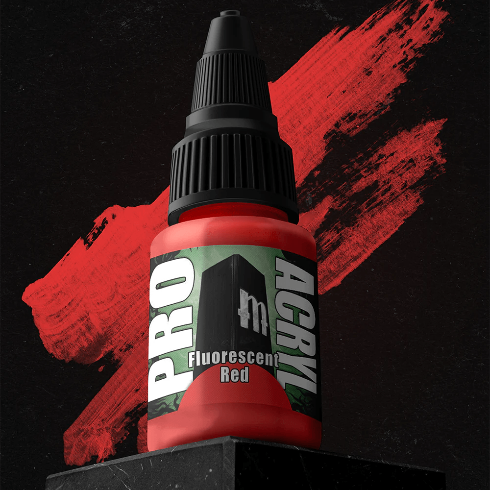 A small bottle of Monument Hobbies' Pro Acryl Fluorescent Red rests on a dark stone block. The high-density pigment stands out against the red paint stroke. Its no-clog cap and textured lid enhance the label's bold green and white text, contrasting with the black background.