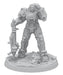 A highly detailed miniature figurine of a soldier in futuristic power armor stands on a textured, rocky base. The armor features intricate mechanical components and the soldier holds a large, advanced weapon with both hands. A damaged gas mask lies on the ground near the figure's feet, evoking scenes from Fallout: Miniatures - Hollywood Heroes (Amazon TV Show Tie-In) by Modiphius.