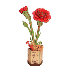 The Robotime Red Carnation is a wooden 3D puzzle of a rose and carnation bouquet, featuring detailed petals, green leaves, and a small "For you" tag. It stands in a floral-designed pot with a circular base of plant motifs, showcasing Wooden Bloom Craft.