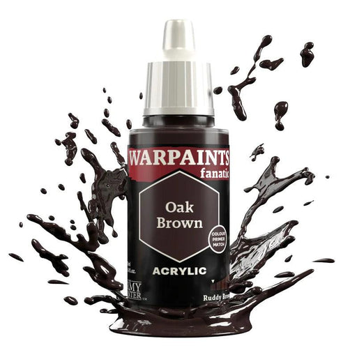 A bottle of Everything Games Warpaints Fanatic: Oak Brown acrylic paint labeled "Oak Brown" with a hexagon showing the color. The bottle is surrounded by splashes of dark brown paint, emphasizing the rich color. The white cap contrasts with the deep brown of the paint and the black bottle label, part of a flexible colour triad system.