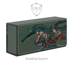 The ASHURA EMBROIDERED DECK BOX by Dueling Guard features a detailed embroidered design on its cover, depicting a warrior wielding dual swords. The intricately stitched swordsman sports dynamic green hair and flowing garments. Crafted from vegan leather, the box showcases a shield logo with a butterfly emblem above the text "Dueling Guard.