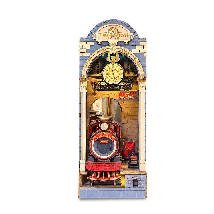 The Rolife "Time Travel 3D Creative Bookend" is a miniature wooden clock styled as a vintage train station, ideal for decorative shelves. It showcases a red and black steam locomotive through an arched entrance with a clock and gear motif above, reading "Welcome to Time Station" beneath the "Time Travel" sign.