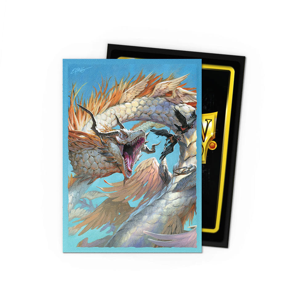 A fantasy card depicts a fierce, multi-headed dragon with orange horns and white scales against a blue sky. One head roars boldly. Protected by Arcane Tinmen's Dragon Shield: Standard 100ct Sleeves - The Ejsingandr (Dual Matte), the card features a gold border with an indistinct logo in the corner.