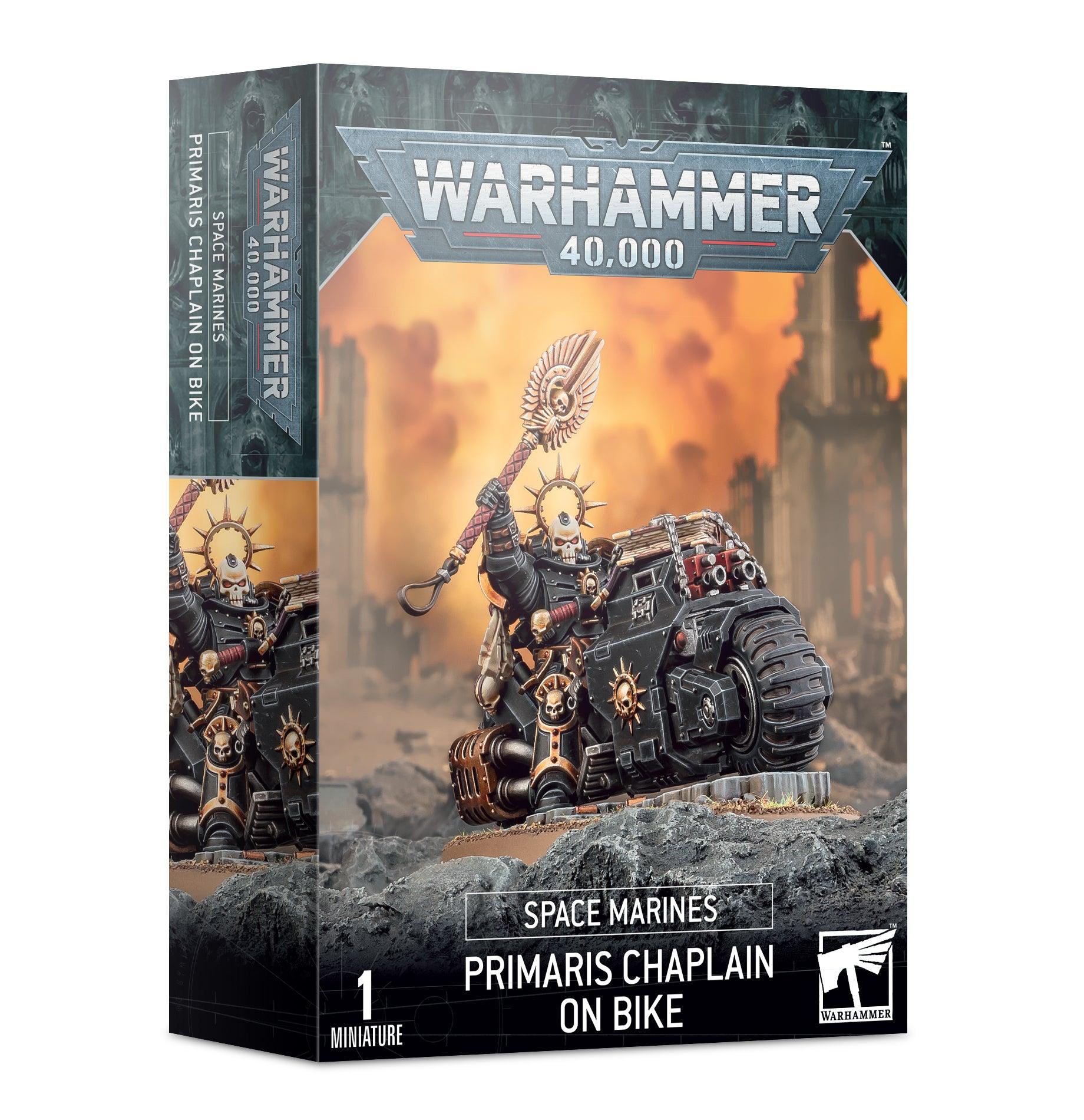 Box of SPACE MARINES: PRIMARIS CHAPLAIN ON BIKE. The box art depicts a highly detailed miniature of this tactical lynchpin in black armor, riding a motorcycle with a mace in one hand, set against a war-torn backdrop. The label reads, 