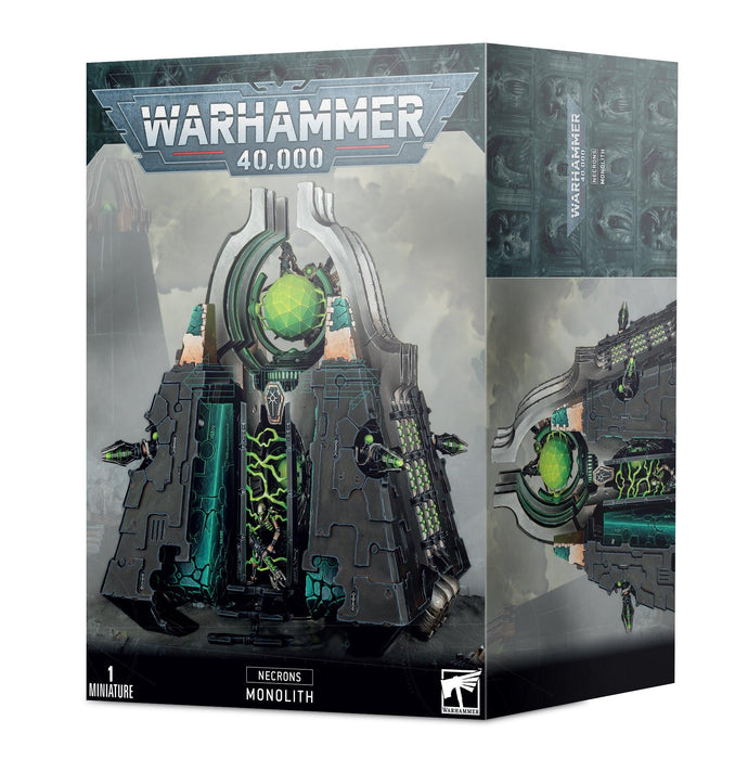 A box of **Games Workshop's NECRONS: MONOLITH**, showcasing its imposing structure made of living metal and armed with devastating gauss flux arcs.