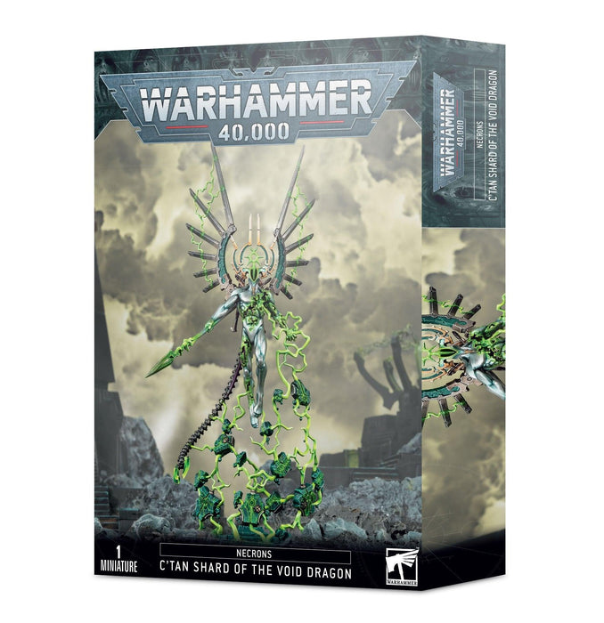 A Games Workshop box showcases the NECRONS: C'TAN SHARD OF THE VOID DRAGON. The cover art reveals a model with an intricate, mechanical design, enveloped in green energy. The background sets a stormy, apocalyptic scene.