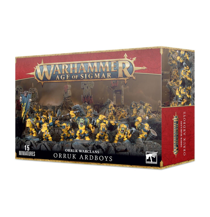Box for the ORRUK WARCLANS: ORRUK ARDBOYZ miniatures. The front shows painted models of armored orcs in yellow and blue, wielding various weapons. The title "ORRUK ARDBOYZ" is below the image with the 'Games Workshop' logo above, and "15 plastic kit miniatures" indicated in the corner from the Ironjawz clans.