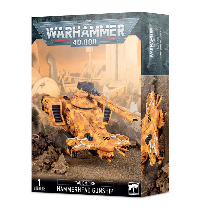 A box for the Games Workshop T'AU EMPIRE: HAMMERHEAD GUNSHIP multipart plastic kit. The box features artwork of a T'au Empire Hammerhead Gunship in desert camouflage colors, hovering over a rocky landscape with sci-fi industrial ruins. The text on the box reads "Warhammer 40,000" at the top and "T'AU EMPIRE: HAMMERHEAD GUNSHIP" at the bottom.