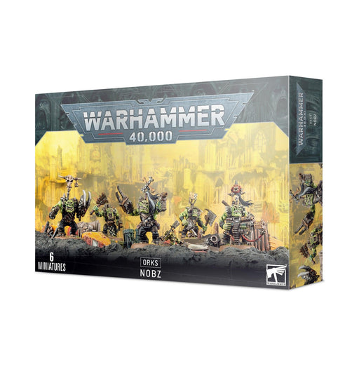 A box of Games Workshop's ORKS: NOBZ miniatures features artwork of six detailed ork figures in various poses, each with different weapon options. The multi-part plastic miniatures are set against a dystopian cityscape with a greenish tint, and the text indicates there are 6 figures inside.
