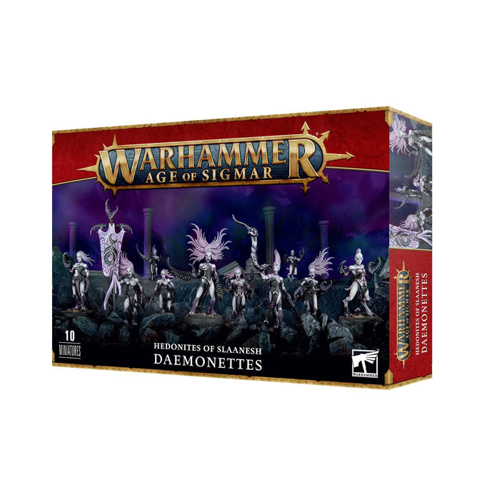 Image of a Games Workshop box set titled "HEDONITES OF SLAANESH: DAEMONETTES." The box features ten multi-part Daemonette figures in dynamic poses, set against a dark, eerie landscape. Predominantly red with gold accents, it includes the Games Workshop logo.
