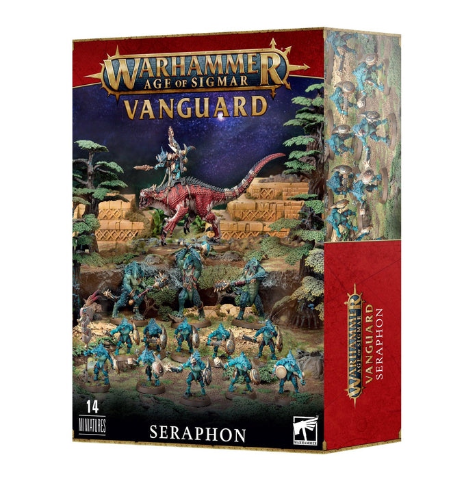 The image shows a Games Workshop SPEARHEAD: SERAPHON box set containing 14 miniatures. The cover art features several Saurus Warriors in a jungle setting with pyramids in the background, including a larger lizard-rider figure. The box, ideal for any Seraphon army, is mostly red with detailed illustrations.
