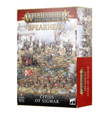 Box of "SPEARHEAD: CITIES OF SIGMAR" Freeguild miniatures set by Games Workshop. The front displays various painted warrior miniatures in a battle scene. The background has a detailed fortress. The set includes 17 Citadel miniatures, as indicated at the bottom left of the box.