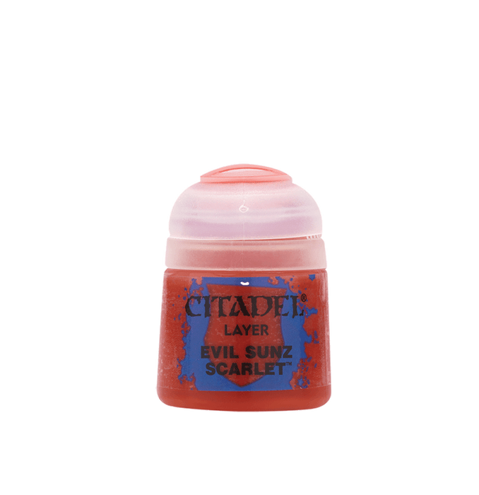 A small plastic paint pot with a light pink lid and a red body is designed for miniatures. The label reads "Citadel Layer - Evil Sunz Scarlet" by Citadel in bold black font on a blue background with red paint splatters. Perfect for edge highlighting, the lid features a small groove for easy opening and closing.