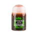 A small, cylindrical container of Citadel Shade paint labeled "Citadel Shade - Reikland Fleshshade" on the front. Ideal for miniatures, the bottle is predominantly brown, with a green and black label bearing white text. The transparent lid is slightly frosted, revealing the matte shading color inside.