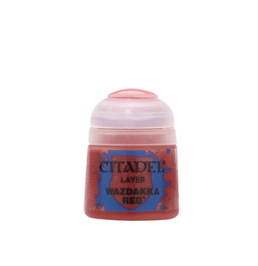 The Citadel Layer - Wazdakka Red paint is ideal for miniatures, featuring a translucent pink cap and red body with a blue label displaying the brand and color name. Perfect for edge highlighting, it's set against a plain light blue background.