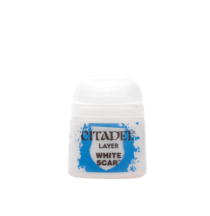A small, white plastic paint container with a round, domed cap. The label reads "Citadel Layer - White Scar" over a blue paint splatter background. This layer paint by Citadel is perfect for edge highlighting miniatures, commonly seen in model and tabletop gaming communities.