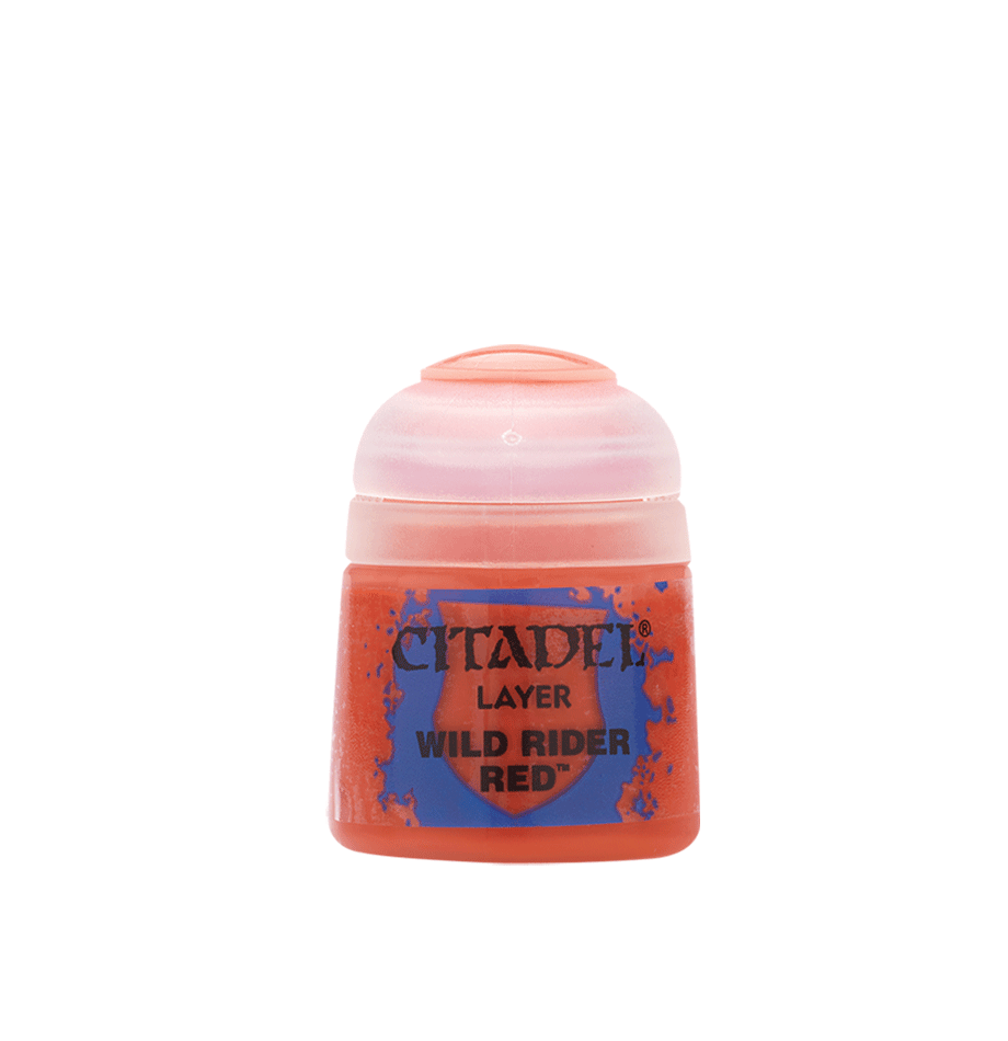 The Citadel Layer - Wild Rider Red is a paint pot designed for miniatures, featuring a cylindrical shape, a translucent flip-top lid, and a vibrant orange body. Its blue label with red and black text includes paint splatter graphics. This shade is ideal for edge highlighting.