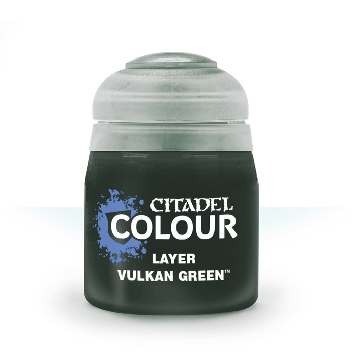 A small cylindrical paint pot with a round cap, labeled "Citadel" in white text. Below, it reads "Citadel Layer - Vulkan Green" on a dark green background, with a splatter design next to the text. Perfect for edge highlighting, the cap is a translucent light grey, and the overall design is minimalist.