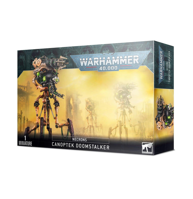 Box of NECRONS: CANOPTEK DOOMSTALKER miniature by Games Workshop. The box features an image of the assembled and painted model, showcasing a mechanical, spider-like robot with a doomsday blaster and green, glowing core. The background shows a yellowish, misty battlefield scene. Perfect for mobile fire support.