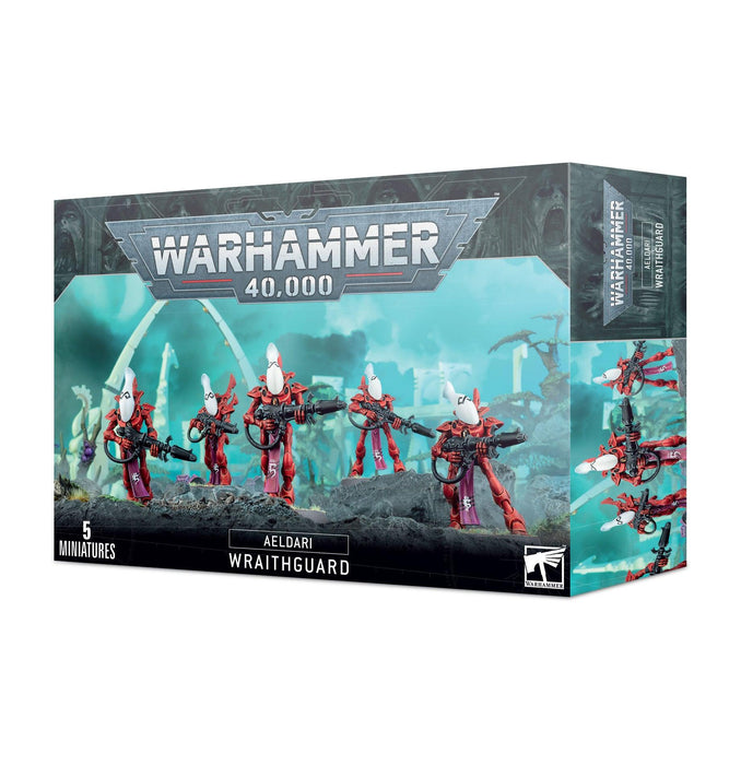 A box of Games Workshop AELDARI: WRAITHGUARD miniatures featuring five Aeldari Wraithguard figures equipped with D-scythes and wraith cannons. The front of the box displays the assembled miniatures in striking red and white armor against an alien landscape backdrop, with "Warhammer 40,000" and "AELDARI: WRAITHGUARD" prominently shown.