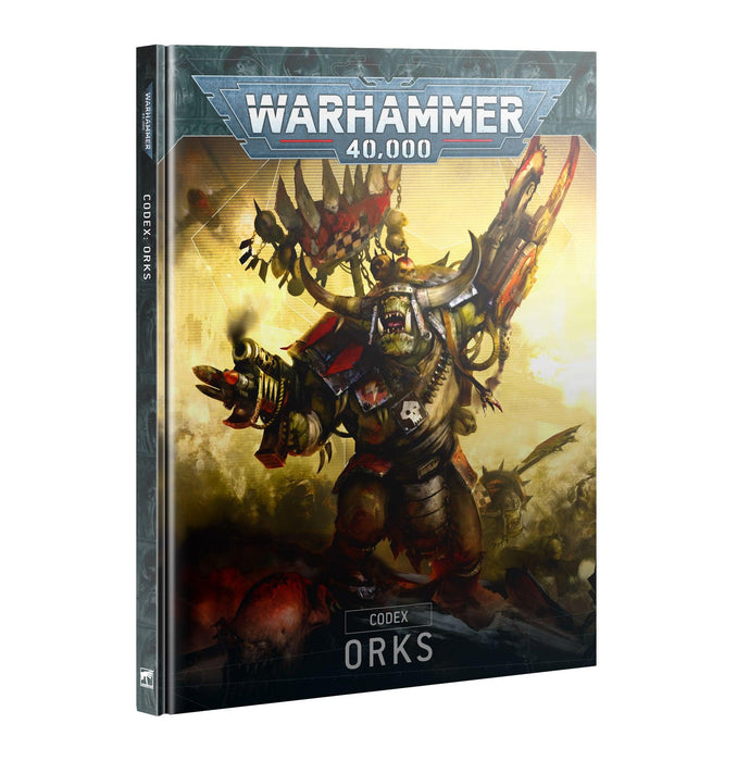 The image shows the cover of the book "CODEX: ORKS (HB) (ENGLISH)." The cover features an Ork warrior in ornate armor, wielding a large mechanical claw and surrounded by fire and battlefield debris. The Games Workshop logo is prominently displayed at the top.