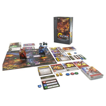 The setup of "Contra: The Board Game" by Kessler Corporation features character miniatures, dice, tokens, and a modular deck system. The upright game box in the background showcases vibrant artwork with action-packed characters and creatures.