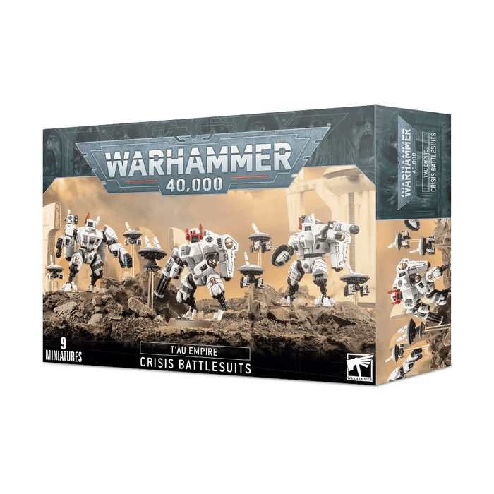 Games Workshop T'AU EMPIRE: CRISIS BATTLESUITS box displaying models of T'au Empire Crisis Battlesuits. The packaging shows an image of multiple white robotic suits, known as XV8 Crisis Battlesuits, armed with various weapons and standing on a rocky battlefield. The text indicates the box contains nine miniatures. Brand and T'au Empire logos are visible.
