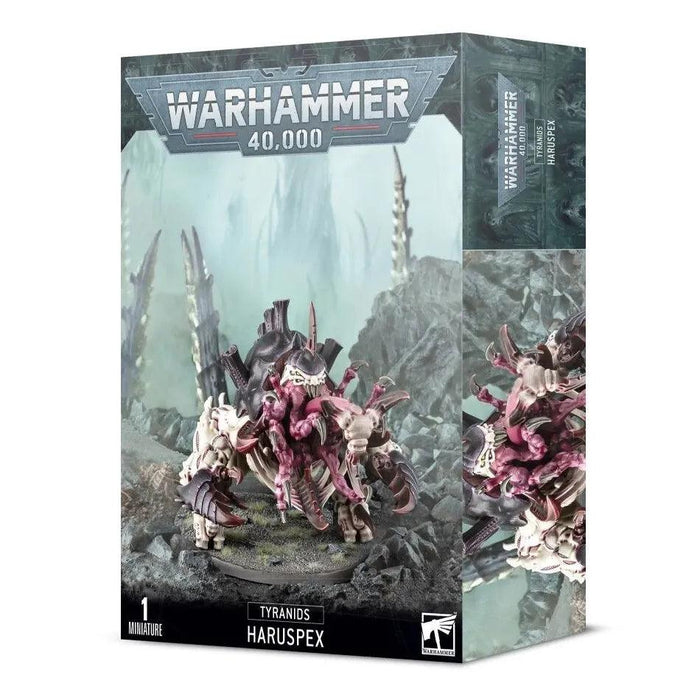 A box of a Games Workshop TYRANIDS: HARUSPEX plastic kit. The box art features an image of the detailed, unpainted model on a rocky terrain, surrounded by sharp rock formations. The Tyranid Haruspex has a monstrous appearance with multiple legs, claws, and a large mouth. Text on the box includes "Warhammer 40,000," "Tyranids," and "Haruspex.
