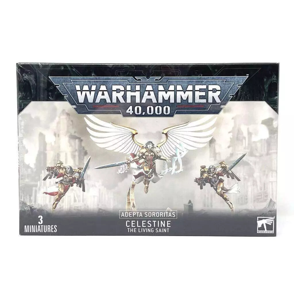 The Warhammer 40,000 miniatures box by Games Workshop features three figures: the central Saint Celestine, the Living Saint with angelic wings, accompanied by two Geminae Superia warriors. The text reads 