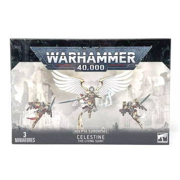 The Warhammer 40,000 miniatures box by Games Workshop features three figures: the central Saint Celestine, the Living Saint with angelic wings, accompanied by two Geminae Superia warriors. The text reads "ADEPTA SORORITAS: CELESTINE LIVING SAINT" and "3 Miniatures.