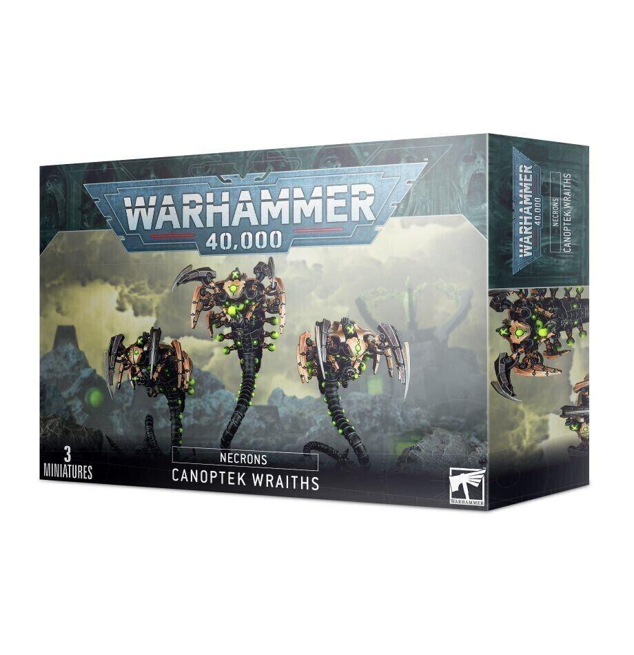 A box of NECRONS: CANOPTEK WRAITHS miniatures from Games Workshop. The box showcases three mechanical, serpentine figures with green glowing elements and a phase shifter, hinting at their dimensional destabilization matrix. The front displays the Warhammer 40,000 logo and labels indicating 