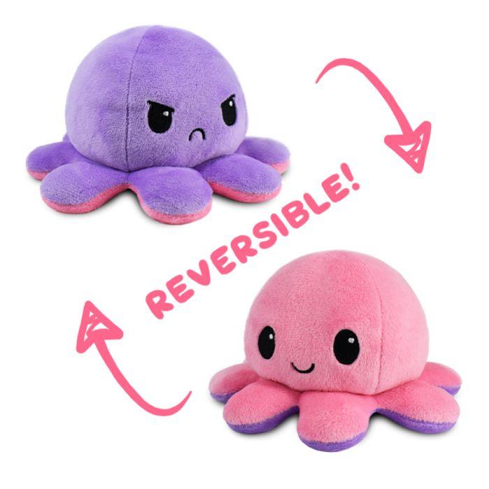 A TeeTurtle Reversible Pink and Purple Octopus Plushie showing two emotions. One side features a purple octopus with an angry, frowning face, and the other side is a pink octopus with a happy, smiling face. "Reversible!" is written in pink text between the two octopuses, with arrows indicating the reversible feature.