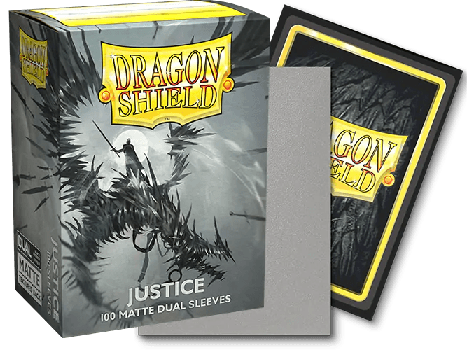 The image shows a box of Dragon Shield: Standard 100ct Art Sleeves - Justice (Dual Matte) by Arcane Tinmen, designed for TCG cards, containing 100 card sleeves. The box features artwork of a warrior battling a dragon in a dark and stormy scene. An open sleeve stands next to the box, showcasing its opaque black back and silver-grey interior.