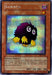 Image of a "Kuriboh [PCY-005] Super Rare" Yu-Gi-Oh! trading card. Kuriboh, an adorable Effect Monster, is depicted as a small, round, furry creature with large eyes and yellow claws. The background is holographic. It has 300 attack points and 200 defense points. Its effect allows you to discard it to reduce battle damage to zero for one turn in Power of