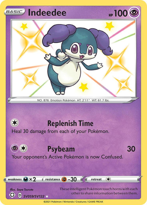 The image shows an Ultra Rare Pokémon card of Indeedee (SV059/SV122) [Sword & Shield: Shining Fates] with a rarity symbol indicating it’s a Shiny variant from the Shining Fates set. The card displays Indeedee, a purple Psychic Pokémon with large ears, a white face, and a smile. It has 100 HP and moves: Replenish Time and Psybeam.
