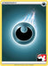 A Pokémon Darkness Energy [Prize Pack Series One] card from Prize Pack Series One featuring a common dark energy symbol, which consists of a black circle with a crescent moon-like shape inside it. The symbol is surrounded by a glowing blue aura. The card has a yellow border and includes game-related text and logos at the bottom-right corner.