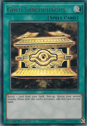 This Ultra Rare "Gold Sarcophagus [YGLD-ENC26]" card from Yu-Gi-Oh! showcases a golden sarcophagus adorned with intricate carvings on a blue holographic background. As a Normal Spell, it lets you banish one card face-up from your Deck and retrieve it during the second Standby Phase after activation.