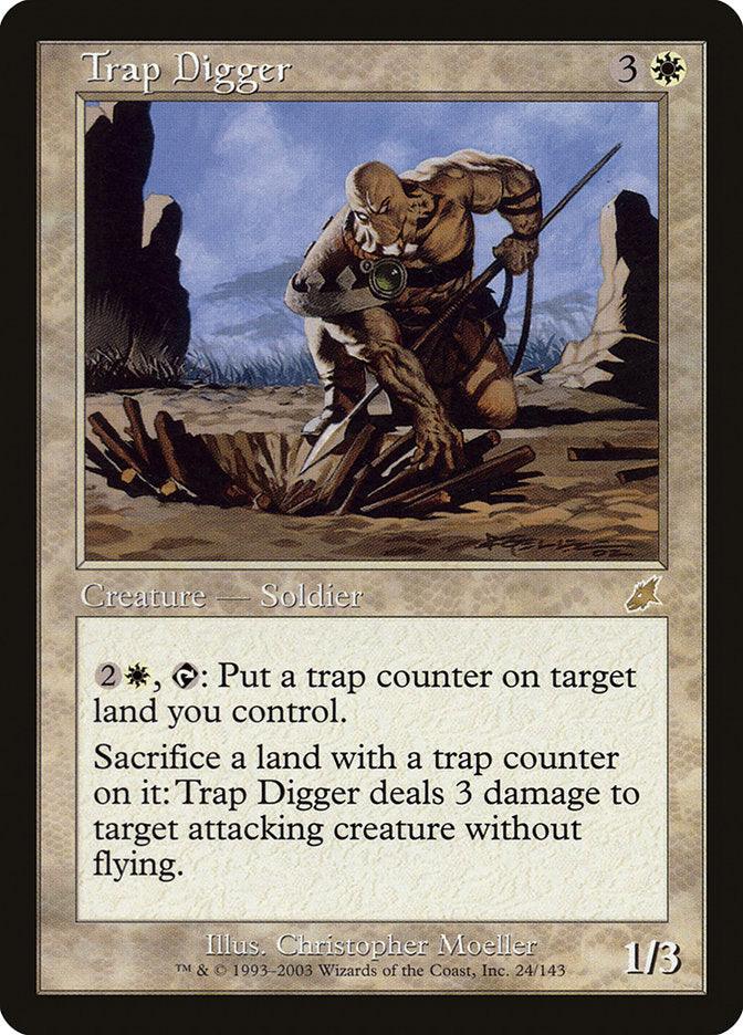 Magic: The Gathering card named "Trap Digger" [Scourge]. This rare creature depicts a muscular, bald human soldier setting a trap in a rocky desert landscape. With a mana cost of 3W, it places trap counters and sacrifices lands to deal damage. Power/Toughness: 1/3. Art by Christopher Moeller.