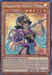 Image of a Yu-Gi-Oh! trading card titled "Palladium Oracle Mana [TN19-EN004] Prismatic Secret Rare." The card features a female Spellcaster with blue skin, wearing ornate gold and black armor, a headdress, and a purple dress. She's holding a staff with a gem. The card has attack points of 2000 and defense points of 1700. Find it in Gold Sarcophagus Tin!