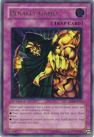 A "Penalty Game! [FET-EN051] Ultimate Rare" Yu-Gi-Oh! trading card with a purple background and "Normal Trap" label. The Ultimate Rare card features an illustration of a hooded figure with an armored golden hand. The text box details the card's game effects, and the bottom displays its Flaming Eternity edition, serial number, and copyright information.