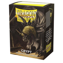 Arcane Tinmen's Dragon Shield: Standard 100ct Sleeves - Crypt (Dual Matte) features a monstrous dragon with leathery wings, sharp teeth, and a horned, armored head against a dark backdrop. The box contains 100 opaque sleeves with black interiors.